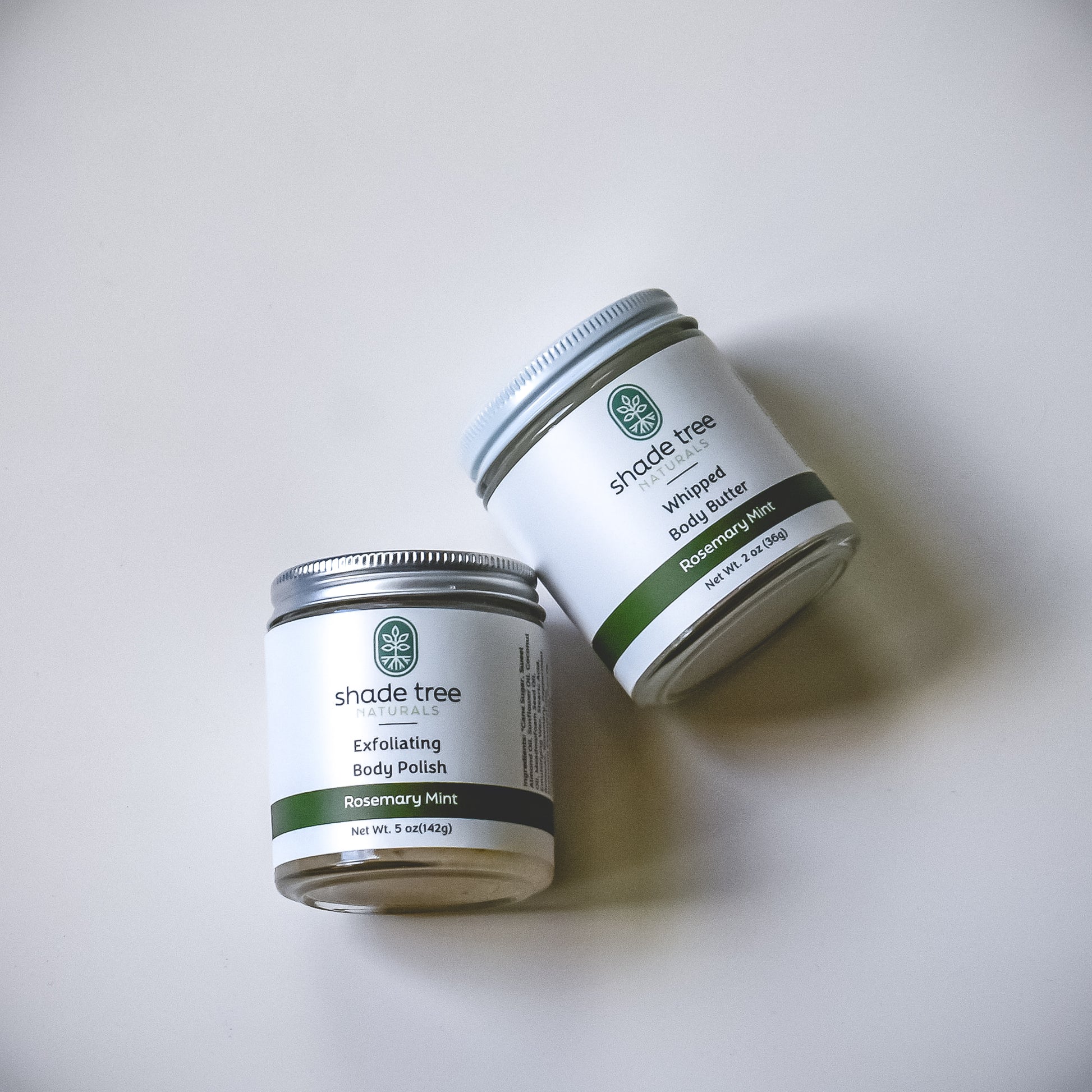Two containers of Shade Tree Skincare products on a white background