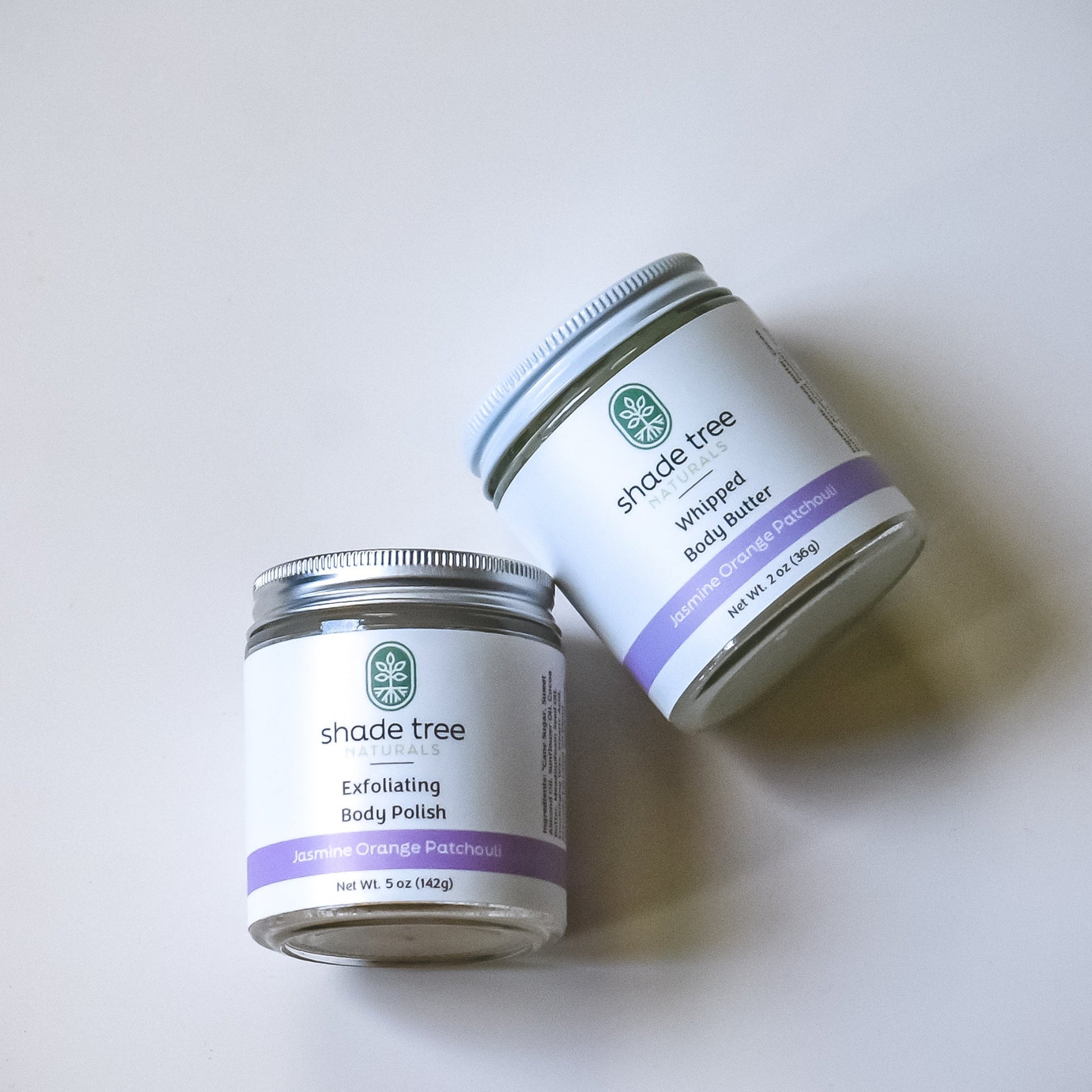 Two jars of Shade Tree skincare products on a white background