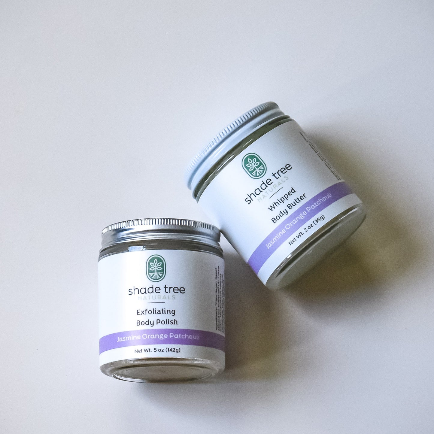 Two jars of Shade Tree skincare products on a white background