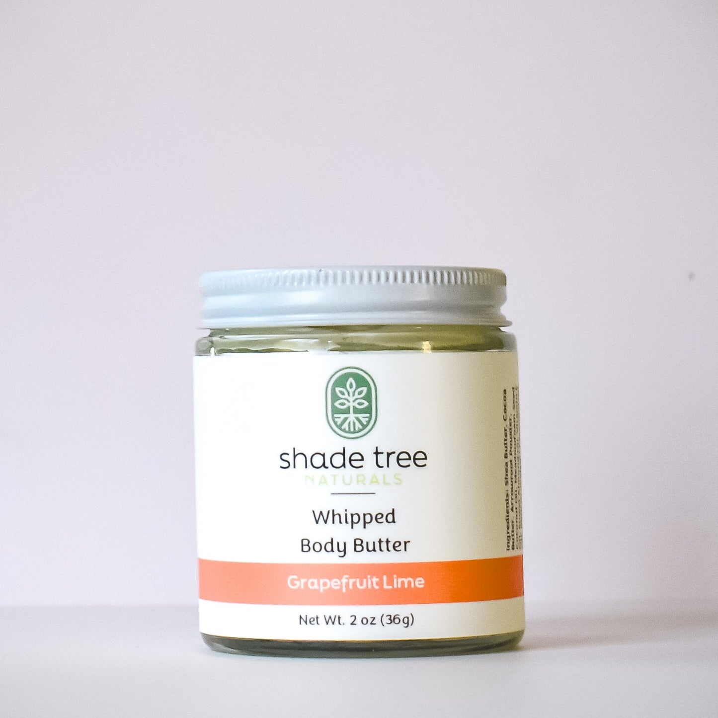 Jar of Shade Tree Whipped Body Butter on a light gray background