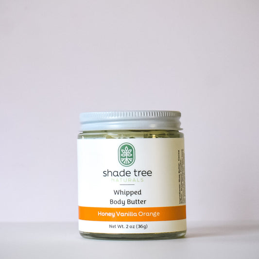 Jar of shade tree whipped body butter on a white background