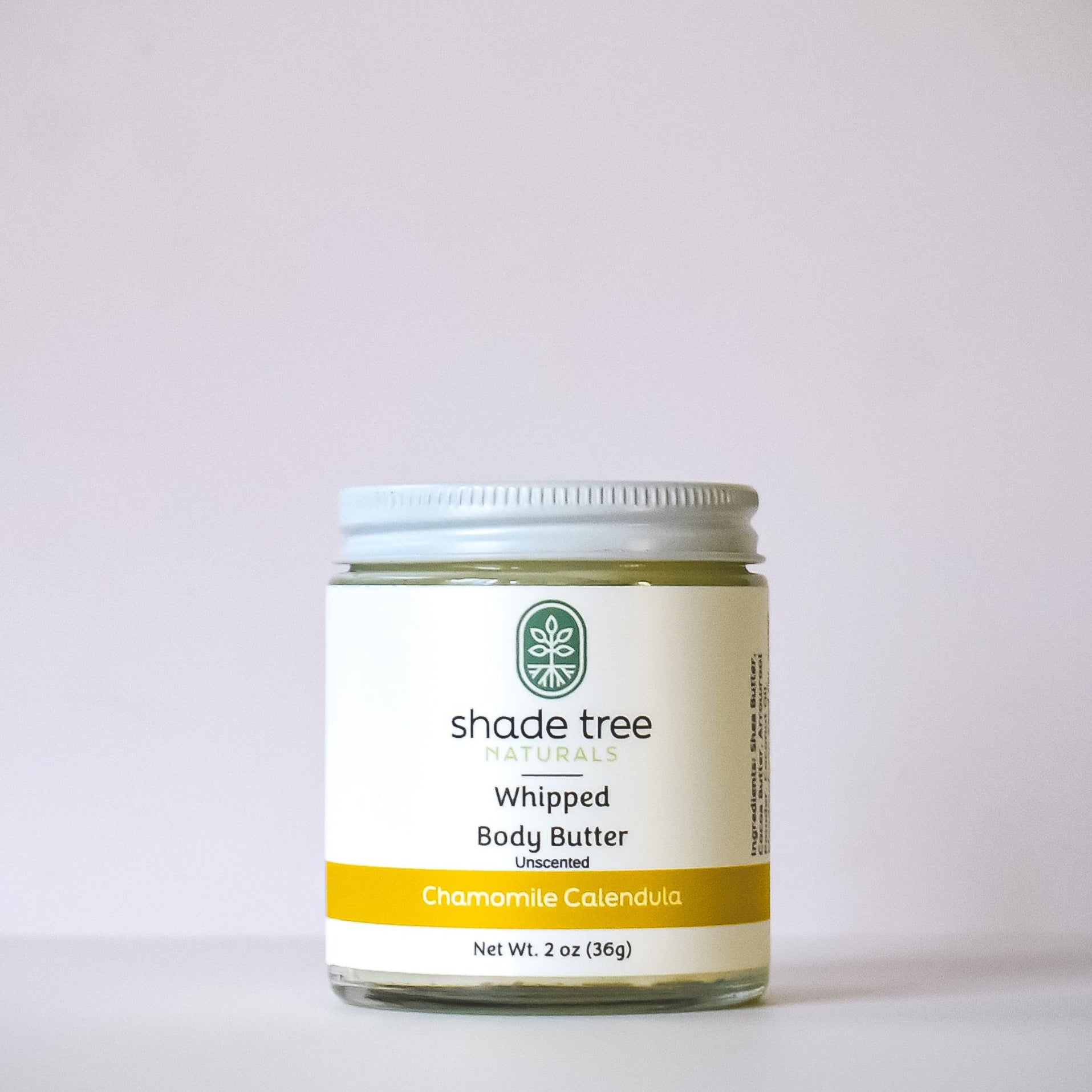 Jar of Shade Tree Whipped Body Butter on a light gray background